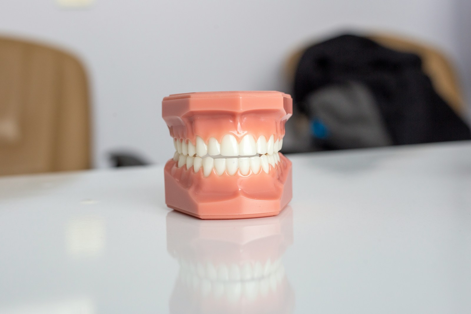 orange plastic container on white table